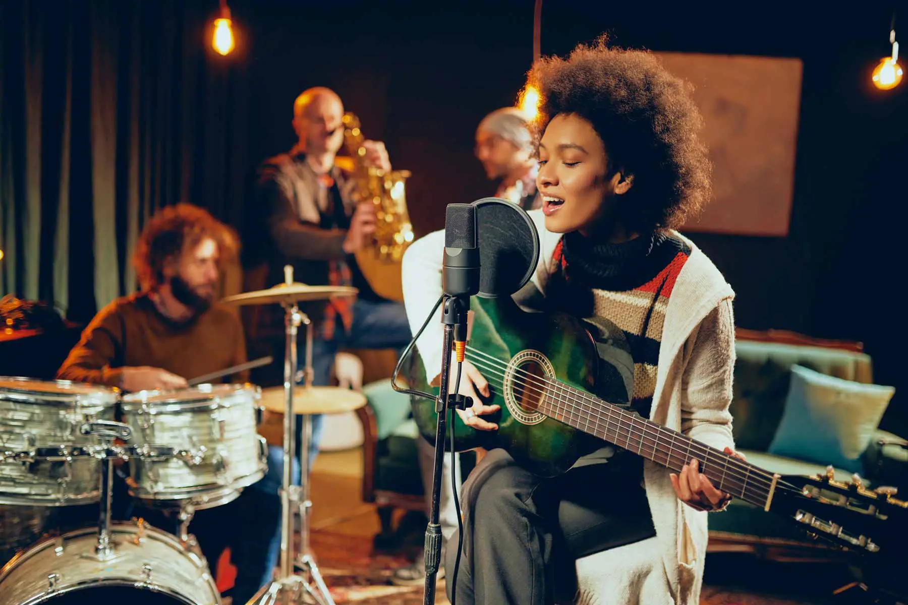 Live jazz beside glasses of red wine at an evening event