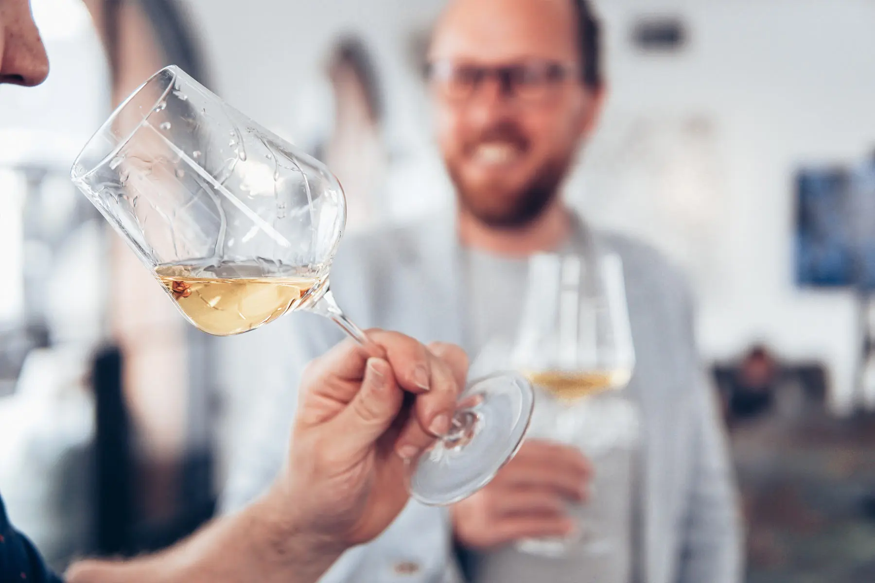 Sommelier pouring a curated flight of wines